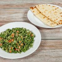 Tabouleh · Cracked wheat, tomatoes, bell peppers, chopped parsley, seasoned onions, lemon juice, and ol...