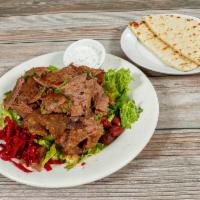 Lamb and Beef Gyro Salad · With fresh tomatoes, cucumber, lemon juice and olive oil dressing.  Served with pita bread.