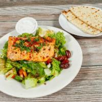 Salmon Salad · Traditional Greek salad with grilled wild salmon, marinated with herbs and Mediterranean dre...