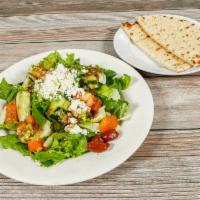 Greek Salad · Romaine hearts, tomato, onion, cucumber, feta, olives and house dressing. Served with pita b...