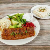 Adana Kebab Plate · Charcoal-grilled minced lamb, lightly spiced with parsley and onions. Served with salad, ric...