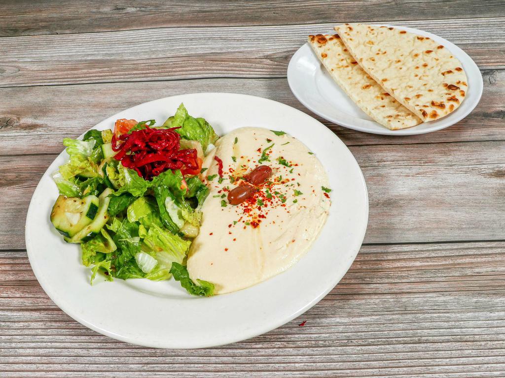 Hummus Plate · Garbanzo beans with garlic, lemon juice, olive oil, and tahini. Served with house salad and pita bread.