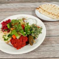 Veggie Combo · Hummus, baba ghanoush, falafel, tabouleh, and dolma. Served with house salad and pita bread.