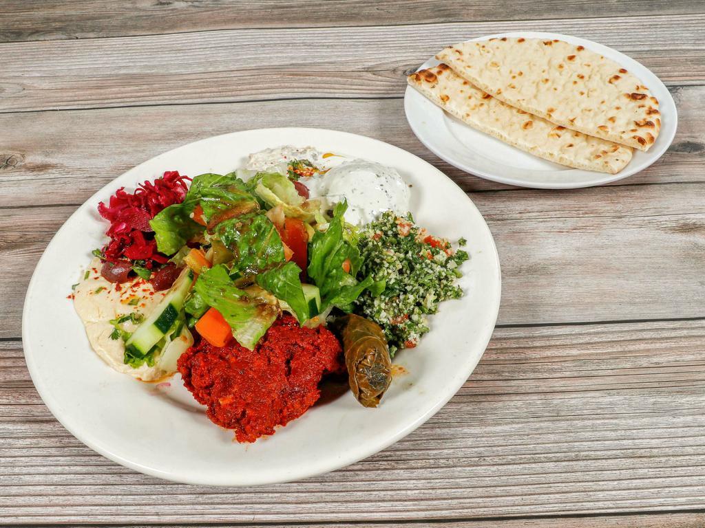 Veggie Combo · Hummus, baba ghanoush, falafel, tabouleh, and dolma. Served with house salad and pita bread.