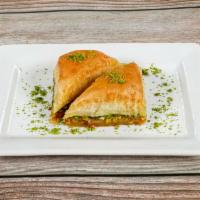 Baklava with Pistachio · Rich, sweet dessert pastry made of layers of filo dough filled with Turkish pistachio. Two p...