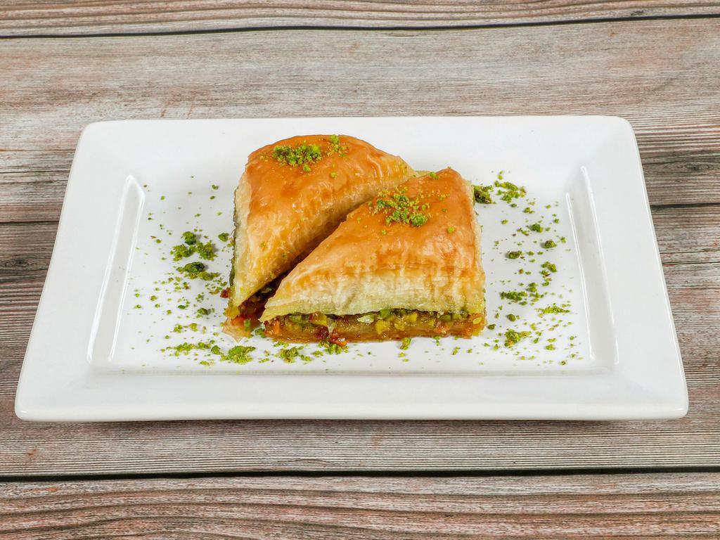 Baklava with Pistachio · Rich, sweet dessert pastry made of layers of filo dough filled with Turkish pistachio. Two pieces.