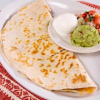 Quesadilla · Cooked tortilla that is filled with cheese and folded in half.