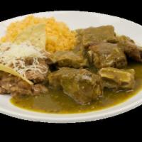 Costillas de Puerco en Salsa Verde plate · Pork ribs.  Comes with rice and beans and tortillas.