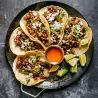 Taco · Choose your meat & style 
STREET: corn tortilla cilantro and onion
AMERICAN: flour tortilla ...