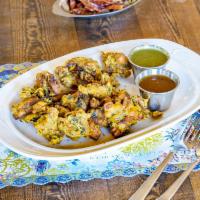 Mixed Vegetable Pakoras · Vegetables with chickpea batter, deep fried. Served with mint sauce and tamarind sauce. Vega...