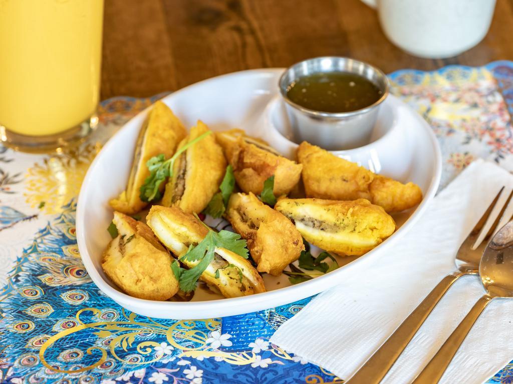 Paneer Pakoras · Homemade cottage cheese with chickpea batter, deep fried. Served with mint sauce and tamarind sauce. Vegetarian. Gluten-free. Nut-free.