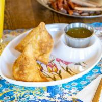 Vegetable Samosas · Two pieces. Deep fried crisp pastry filled with mixed vegetables. Served with mint sauce and...