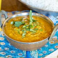 Dal Curry a la Carte · Mildly spiced lentil curry. Served with basmati rice. Gluten-free. Nut-free. Vegan.