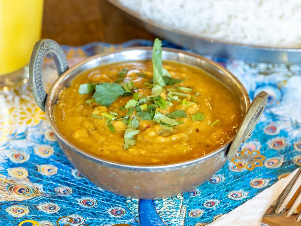 Dal Curry a la Carte · Mildly spiced lentil curry. Served with basmati rice. Gluten-free. Nut-free. Vegan.