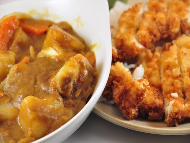 Japanese Chicken Curry Dinner · breaded fried chicken on a plate of white rice and served with Japanese curry