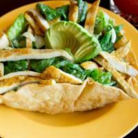 Mexican Chicken Caesar Salad · Grilled chicken on top of fresh Romaine, roasted pepitas, crisp tortilla strips, Cotija chee...