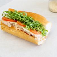 Grand Central Sandwich · Turkey and provolone with arugula, roasted red peppers spread, tomatoes, olive oil, and bals...