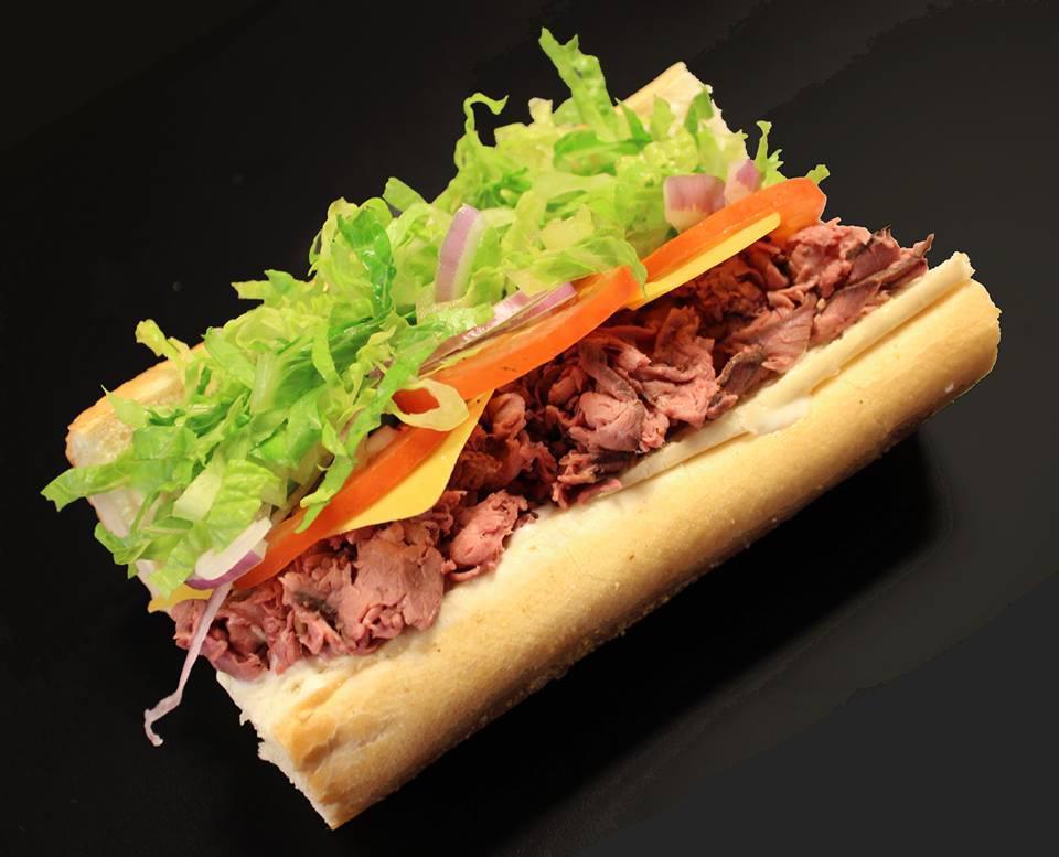 St. Patricks Sandwich · Roast beef and aged cheddar, sliced red onion, romaine lettuce, tomatoes, and horseradish aioli.