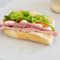 Wall Street Sandwich · Prosciutto di parma, fresh mozzarella, basil leaves, sun dried tomato spread, olive oil, and...