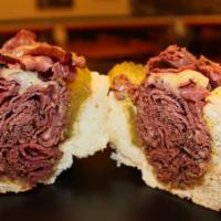 Pastrami and Swiss Sandwich · Served with mustard and dill pickles.