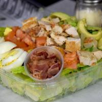 Cobb Salad · Fresh Romaine lettuce with Roma tomatoes, slices of avocado and boiled egg's, with grilled c...