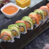 Tiger Roll · Spicy kani and mango inside, topped with salmon, avocado, special sauce and mango sauce. Wra...