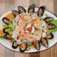 Seafood Salad · Salad with a seasoned mixed seafood base that is occasionally dressed with mayonnaise. 