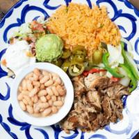 Carnitas Michoacan · Pork shoulder slowly braised in spices. Served with pico de gallo, sautéed onions, peppers, ...
