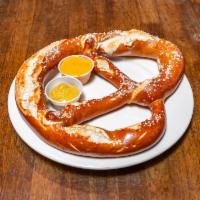 Bavarian Pretzel · Served with spicy brown mustard and our jalapeno beer cheese sauce.
