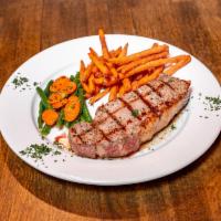 New York Strip Steak · 16 oz. grilled New York strip steak with your choice of potato and vegetable du jour.