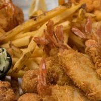 Shrimp ＆ Seafood Ensemble · Crispy fried shrimp, coconut shrimp, popcorn shrimp, fish fillet, with fries, coleslaw and h...