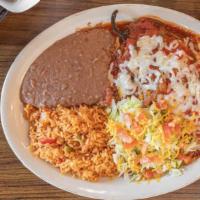 36. Chile Relleno · Poblano pepper stuffed with ground beef or shredded chicken and fried in egg batter. Topped ...