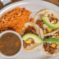 55. Pork Tacos · 5 corn tortillas filled with pork loin slow cooked al pastor with pineapple, diced onions an...