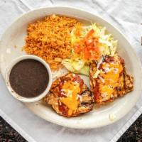 62. Chicken Monterrey · Marinated, grilled, and boneless chicken breast topped with ranchero sauce and melted Monter...