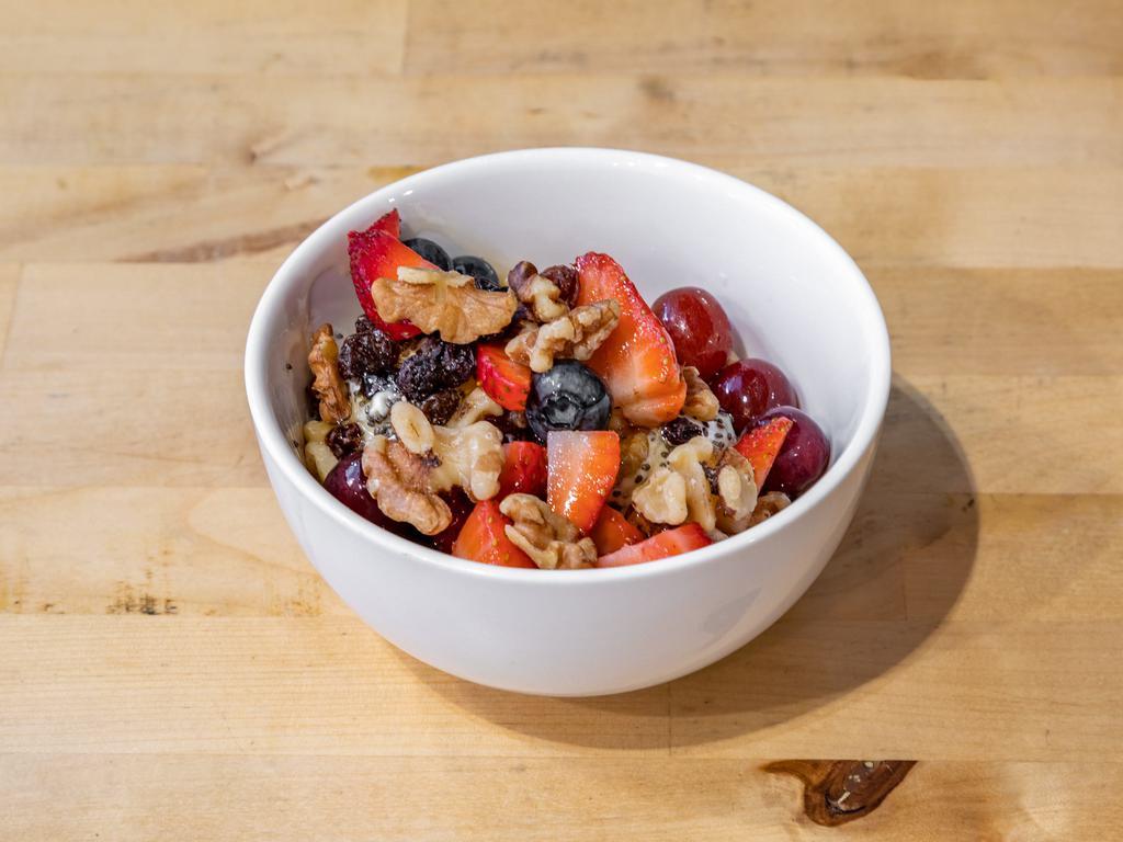 Greek Yogurt · Greek yogurt, honey, walnuts, raisins, chia seeds, and fresh fruit.