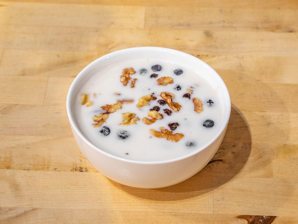 Overnight Oats · Blueberries, chia seeds, honey, and oats soaked overnight in almond milk.