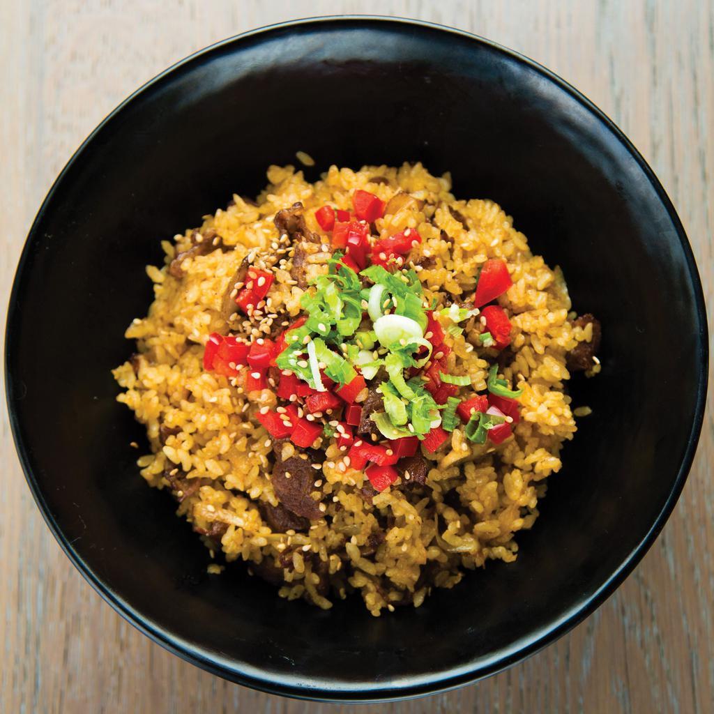Sukiyaki Fried Rice with Beef Bowl · Our signature thin-sliced Sukiyaki-marinated beef stir-fried with white rice, egg yolk, mushrooms, and sliced onions. Topped with diced red bell peppers, chopped green onions, and sesame seeds.