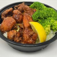 Hot Chicken Karaage Bowl · Japanese Fried Chicken tossed in a housemixed Japanese hot sauce blend on a bed of Shredded ...