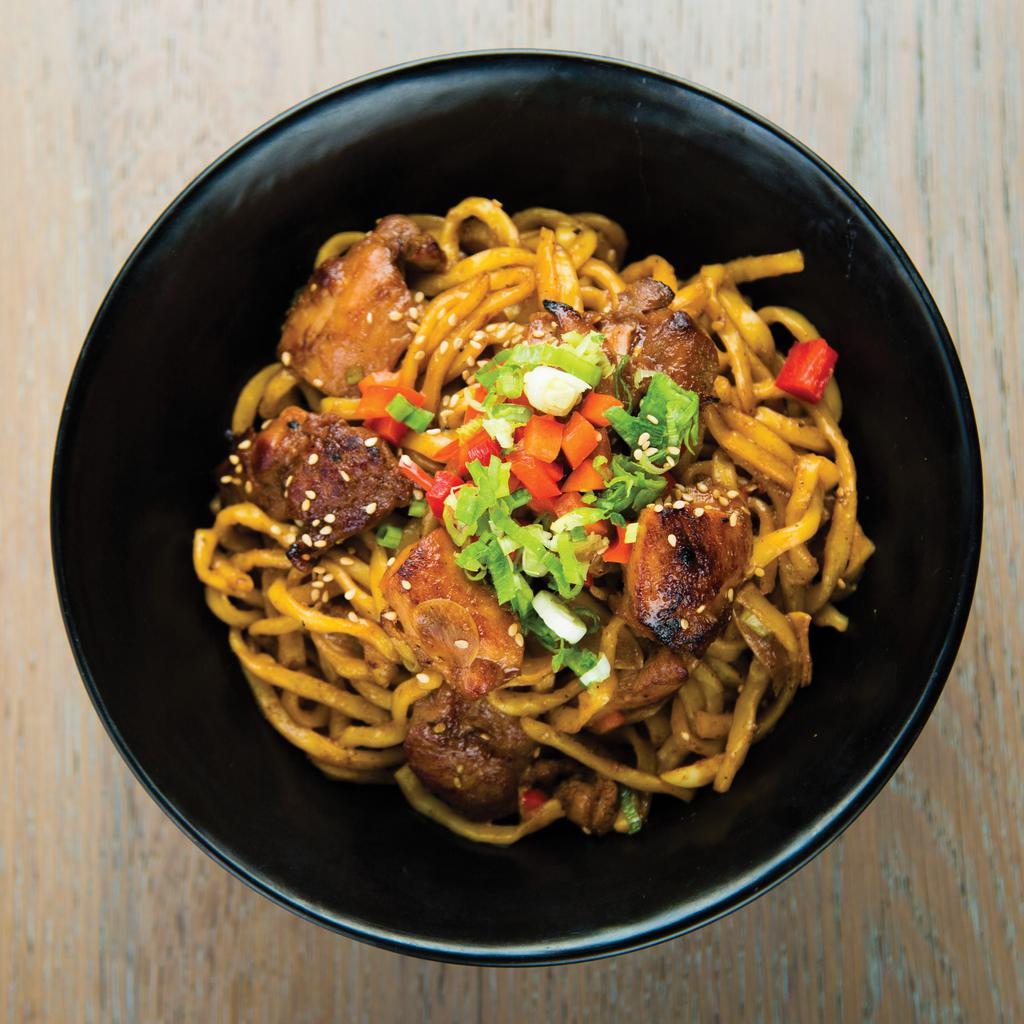 Garlic Noodles with Chicken · Thick Japanese noodles stir-fried with chicken, sliced garlic, butter, and soy sauce. Topped with diced red bell peppers, chopped green onions, and sesame seeds.
