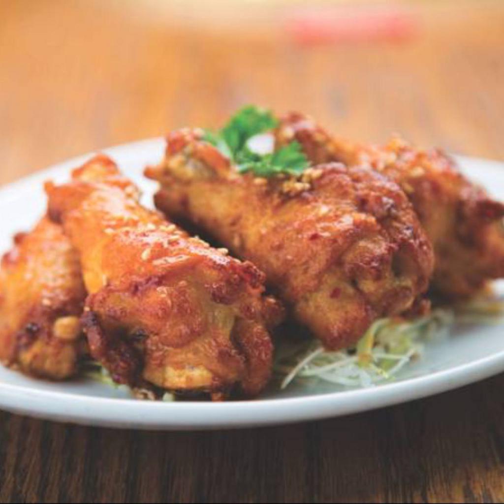 Miso Chili Wings · Five (5) fried chicken wings coated in our sweet & spicy Miso Chili sauce.