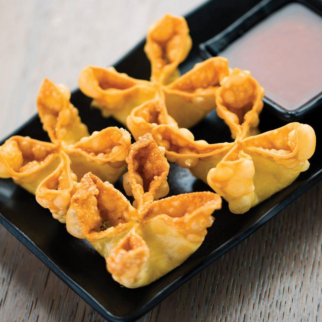 Fried Cheese Wontons · Crispy fried wontons filled with cream cheese and green onions. Served with sweet chili sauce.
