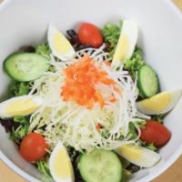 Gyu-Kaku Salad · Mixed greens, sliced cucumber, cherry tomatoes, and diced red bell pepper. Topped with a boi...