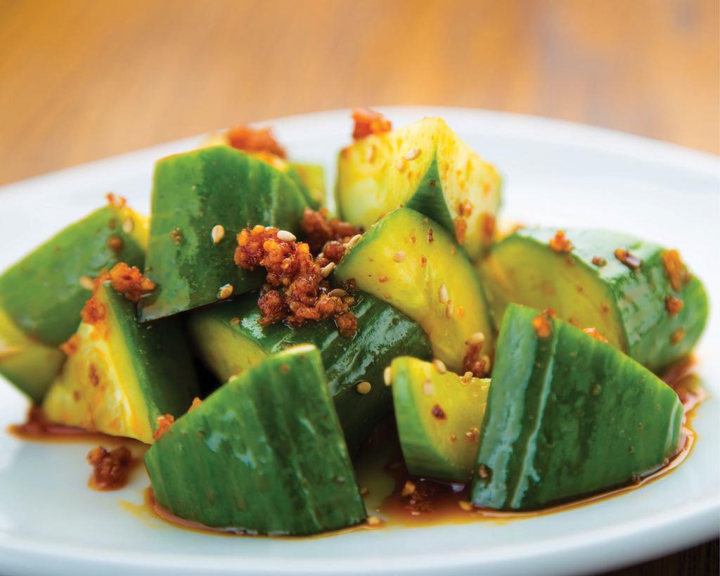 Spicy Addicting Cucumber · Fresh cucumbers in Crunchy Garlic Chili Oil with a dash of Shio Tare, sesame oil, and sesame seeds.