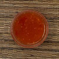 Sweet Chili Sauce (approx 1 oz each) · A mildly spicy sauce perfect for dipping spring rolls or fried cheese wontons. Photo is mean...