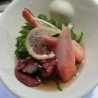 Sunomono · Chef's choice sashimi with thinly sliced cucumber in vinegar dressing. 