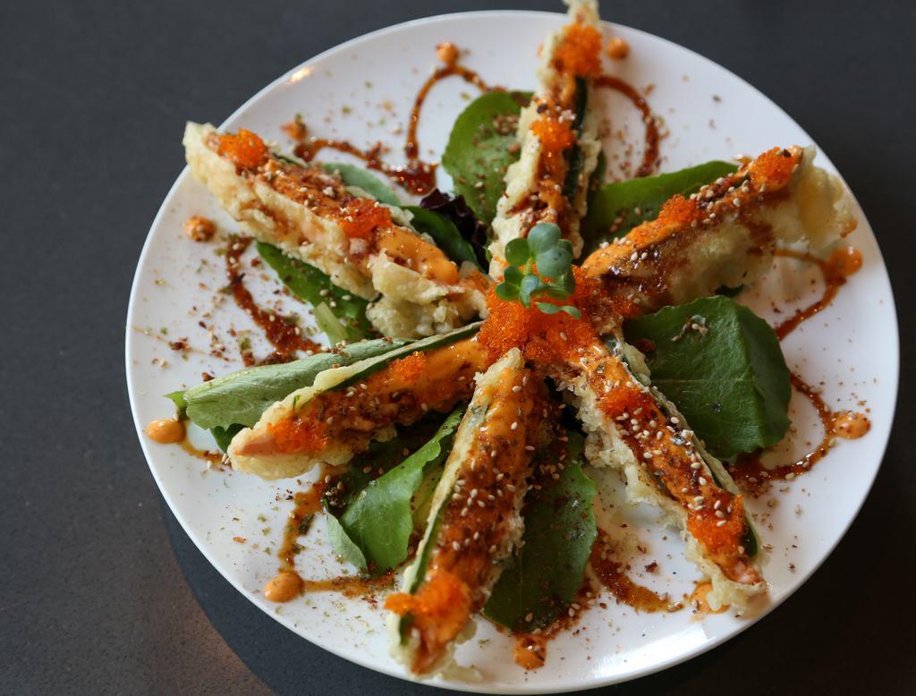Jalapeno Poppers · Fried jalapeno with fresh salmon, cream cheese and tobiko. 