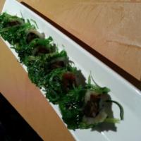 Swamp Roll · Spicy tuna roll topped with seaweed salad. 