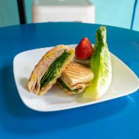 Panini Turkey Avocado · Turkey breast and spinach. Prepared with Swiss cheese, mayonnaise, mustard, tomato and avoca...