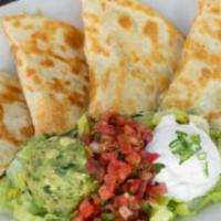 Quesadilla · Large flour tortilla filled with cheese and served with lettuce, pico de gallo, and sour cre...