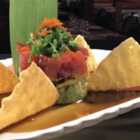 Tuna Tacos  · Crispy taco shells filled with spicy tuna and mango salsa.